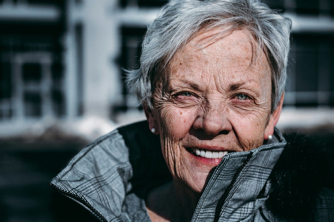 Smiling senior woman, illustrative dental content concept