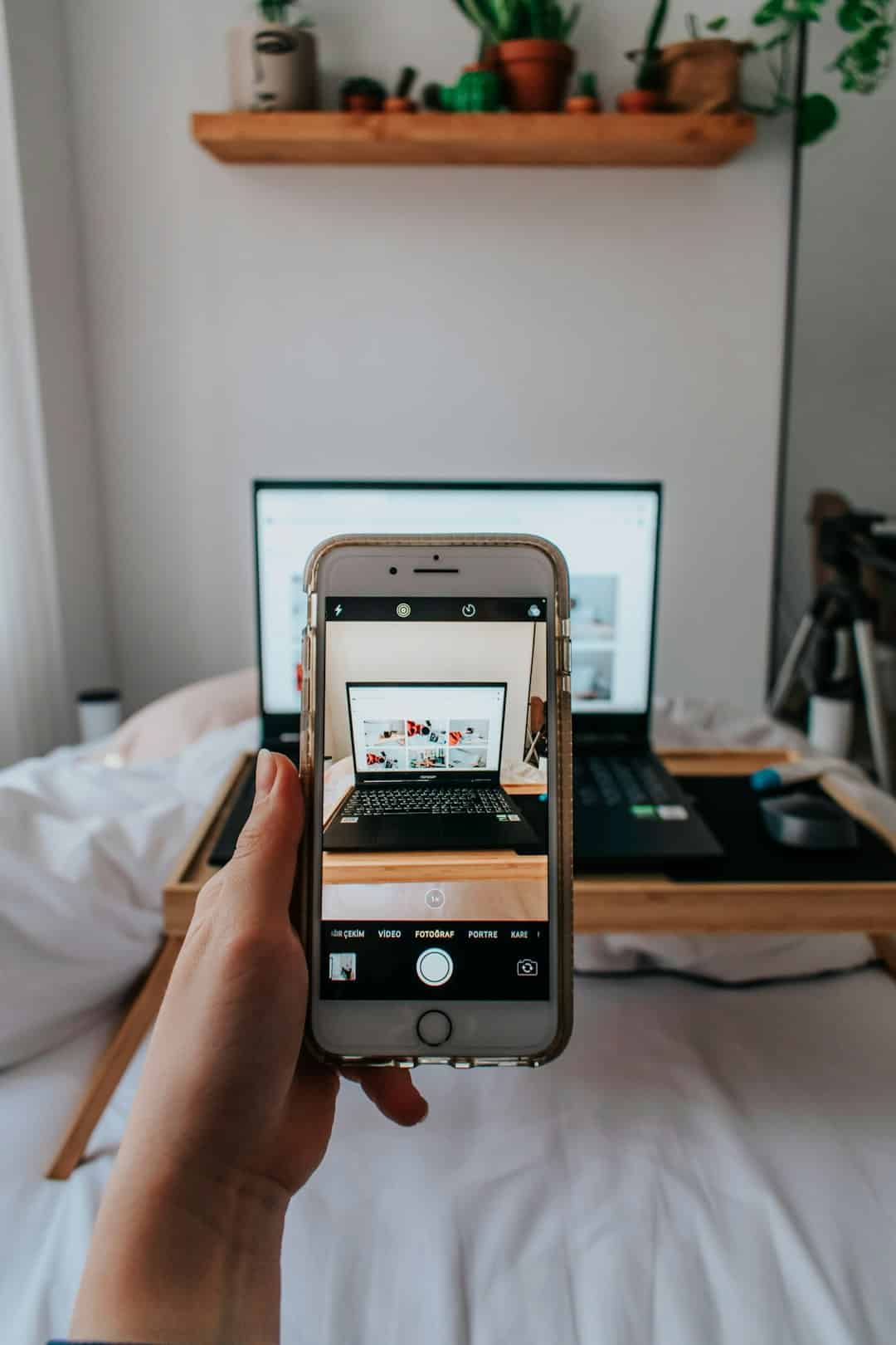 Person holding a smartphone while browsing content
