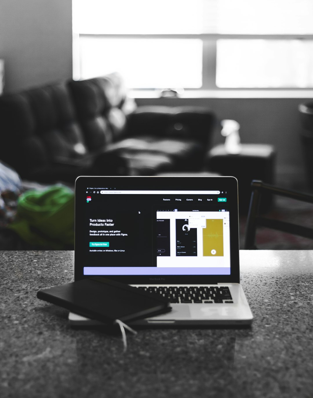Website designer working on a digital page layout on a laptop